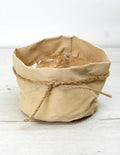 Cubremacetas beige con cordón de yute de estilo natural